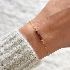 "This hand made bracelet showcases a stunning selection of garnet stones, centered on a dainty but durable chain in your preferred finish. This makes a wonderful gift for someone with a January birthday, or any garnet-lover in your family or friend circle. Chain Finish Options: * Gold Filled * Rose Gold Filled * Sterling Silver Bracelet Size Guide: Petite: 6.5\"-7\" Average (fits most wrists): 7-8\" Large: 8-8.5\" Adjustable: 6.5\" bracelet with 1.5\" extender chain affixed to jewelry (Adjustabl Adjustable Garnet Bracelet Gift, Adjustable Garnet Bracelet As Gift, Adjustable Garnet Bracelets Gift, Ruby Bracelets As A Gift, Friend Circle, Circle Chain, Handmade Gemstone Jewelry, Handmade Crystal Jewelry, January Birthday