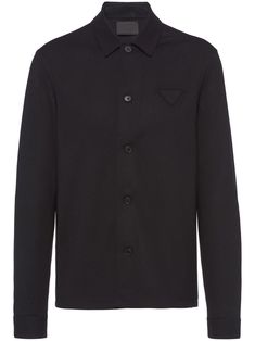 Black cashmere-wool blend button-up long-sleeve shirt from PRADA featuring triangle logo, classic collar, front button fastening, drop shoulder, long sleeves, buttoned cuffs and straight hem. Luxury Long Sleeve Shirt With Button Closure, Luxury Long Sleeve Shirt, Luxury Button-up Tops For Business, Designer Business Tops With Button Closure, Luxury Business Tops With Button Closure, Designer Long Sleeve Business Tops, Designer Long Sleeve Tops For Business, Black Luxury Button-up Top, Luxury Black Button-up Top