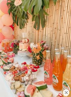 a table topped with lots of different types of food and drinks on top of it