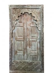 an old wooden door with intricate carvings on the front and side doors, isolated against a white background