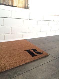 a door mat with the letter b on it