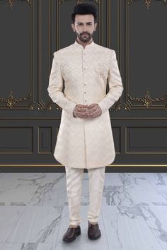 Embrace effortless elegance with our Mens Sherwani- V20-S46. Featuring a sleek design and a budget-friendly price, this sherwani effortlessly elevates your festive look. Experience the luxury of simplicity with our exquisite sherwani. Luxury Bandhgala For Groom, Elegant Designer Wear Sherwani With Straight Kurta, Classic Sherwani For Wedding And Festive Occasions, Elegant Designer Wear Off White Bandhgala, Designer Cream Fitted Kurta, Elegant Designer Off White Bandhgala, Classic Wedding Sherwani For Festive Occasions, Classic Wedding Sherwani For Festive Season, Elegant Off-white Designer Bandhgala