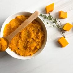 a white bowl filled with mashed sweet potatoes