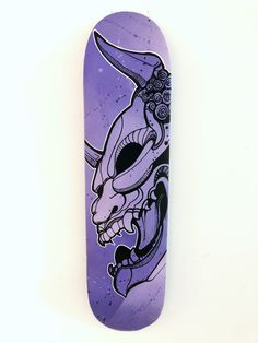 a purple skateboard with an image of a rabbit on it's back end