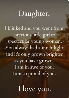 a person walking down a road with the words daughter on it