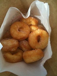 a basket filled with donuts sitting on top of a table