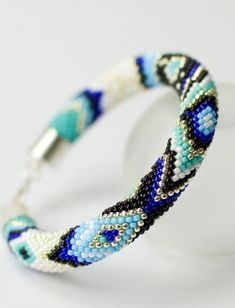 a beaded bracelet with blue and white beads