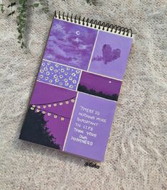 a purple notebook with some pictures on it