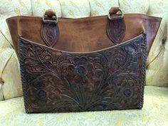 Cut off for custom-made bags in time for Christmas is December 10th. Please text or call 972-239-1777 for availability/rush options after December 10th.Featuring a vegetable dyed, hand tooled mahogany brown exterior pocket, this handbag is high fashion and high function. The exterior pocket on the back is made of bison and has additional places inside for everything you need. Whipstitched edges and footed bottom make this bag one to be used for years. Other leather option finishes are available. Brown Hand Tooled Satchel For Travel, Brown Hand-tooled Satchel For Travel, Vintage Brown Hand Tooled Bag For Travel, Hand Tooled Brown Satchel For Travel, Vintage Brown Hand Tooled Bag For Everyday Use, Brown Hand Tooled Tote Bag, Brown Rectangular Hand Tooled Satchel, Brown Rectangular Hand-tooled Satchel, Brown Hand Tooled Rectangular Satchel