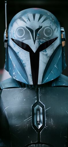 a star wars character wearing a helmet with an owl on it's face and eyes