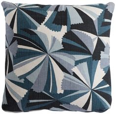 a blue and white pillow with an abstract design on the front, in black and white