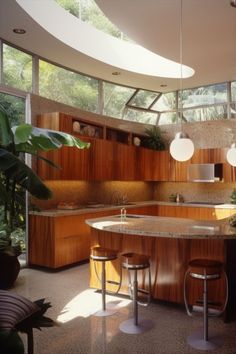 a kitchen with wooden cabinets and stools next to a counter top in front of a large window