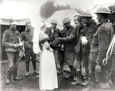 WWI - After being treated for wounds, the soldiers give the nurse a dog that they found in the trench. Battle Of The Somme, Military Uniforms, Historical Events, Military History, First World, A Dog, Soldier