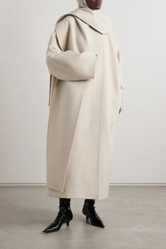 The Row's 'Notte' coat is designed with draped panels along the neck that create the illusion of a coordinating scarf. Made from plush cashmere, it has a loose, longline shape and comes in a versatile beige hue. Jil Sander Coat, Draped Coat, Fringe Coats, Scarf Jacket, Coat Trends, Cashmere Coat, Cashmere Wool, Coat Fashion, Fashion Sketches