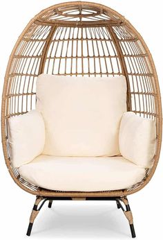 a rattan chair with a white cushion