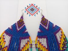 "Beautifully handmade Native American Style Seed Bead Earrings with woven in a combination of desert and mountain colors. Traditional native style design at nearly 6\" off the ear. Colors and styling great for matching your favorite dancing regalia or to wear on its own. Made with stainless steel ear wires and genuine high quality beads. All handmade and Shipped Free from Hawaii with Aloha!" Fair Trade Multicolor Beaded Earrings For Festival, Multicolor Fair Trade Beaded Earrings For Festival, Traditional Purple Beaded Earrings For Festivals, Handmade Southwestern Multicolor Earrings, Southwestern Multicolor Beaded Earrings For Beach, Artisan Purple Beaded Earrings, Handmade Southwestern Multicolor Beaded Earrings, Handmade Multicolor Southwestern Beaded Earrings, Southwestern Multicolor Beaded Earrings