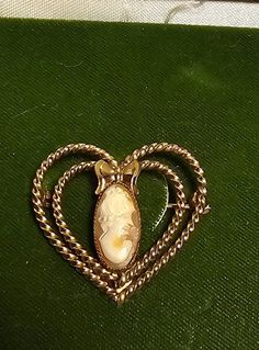 "This exquisite 14k gold filled cameo set pin brooch from the 1950s will undoubtedly become the centerpiece of your jewelry collection.  Pin: 1\" Earrings: .25" Vintage Charm Jewelry For Valentine's Day Formal, Vintage Charm Jewelry For Valentine's Day Formal Occasion, Formal Vintage Charm Jewelry For Valentine's Day, Victorian Jewelry With Hallmark For Valentine's Day, Elegant Brooch For Valentine's Day, Vintage Wedding Brooches For Valentine's Day, Elegant Valentine's Day Brooch Jewelry, Elegant Valentine's Day Brooch, Vintage Cameo Brooch In Yellow Gold