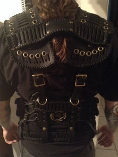 the back of a man with large metal straps