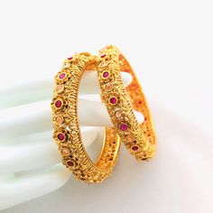 "2.6 Ruby Kundan Kada/Golden Kundan bangles/Handcarved Bangles/Jadau Bangles/Kundan Bridal bangle/Kundan wedding jewelry@AryaFashions This bangles set is handcrafted with love and creativity and are perfect for any occasion may it be engagement, Wedding or any bridal ceremonies or social get-together. Pair them up with Indian traditional outfit such as Anarkalis, Lehengas or Sarees and be the \"Diva\" at your next special occasions, or party. Handcrafted To Perfection Light Weight Perfect For In Rajwadi Bangles, Jadau Bangles, Kundan Kada, Cz Bangles, Traditional Wedding Jewellery, Ruby Bangles, Kundan Bangles, Bangles Making, Bangles Indian