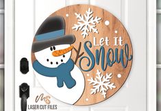 a wooden sign with a snowman on it that says let it snow laser cut files