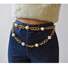 Vintage Gold Link Chain Swag Belt With Faux Pearls, Circa 1990s. Dramatic Etched Gold-Tone Double Link Chain Belt With Large Scale Faux Pearl Details. The Double-Layer Chain Can Be Positioned At The Wearer’s Front Or Side. The Adjustable Tail Is Complete With A Singular Pearl At Its End. Perfect Over Jeans Or A Dress. Similar To Styles Produced By Cc And Other Luxury Designers. Condition: Great Vintage Condition. Light Finish Variation To Chain And Faux Pearl Surface Throughout. Specs: 37 3/4” T Gold Chain Belt, Layer Chain, Pearl Details, Gold Link Chain, Beaded Belt, Gold Link, Layered Chains, Chain Belt, Pearl Color