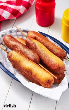 some fried food is on a plate with toothpicks