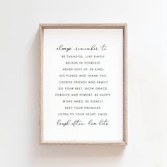 a wooden frame hanging on the wall with a poem in it