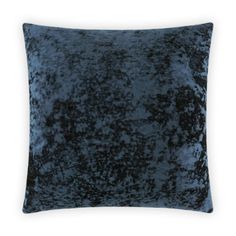 a dark blue velvet pillow on a white background