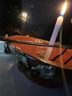 a candle that is sitting in a boat