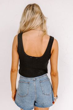 Keep cool all summer long in our trendy black 'Beach Daydream' top featuring ultra lightweight loose knit material, a scooped neckline, 1-inch shoulder straps, and a flattering silhouette that ends in a straight cropped hemline! For additional coverage, we recommend styling over your fave bralette! Measurements S : Bust 32", Length 16", Waist 30". M : Bust 34", Length 17", Waist 32". L : Bust 36", Length 18", Waist 34". Black Crop Top Tank Top For Beach, Black Knit Tank Top For Beach, Black Knit Tank Top For The Beach, Trendy Black Crop Top With Scoop Neck, Trendy Black Scoop Neck Crop Top, Knit Scoop Neck Crop Top, Black Summer Crochet Top For Beach, Black Crochet Summer Top For Beach, Trendy Scoop Neck Tank Top For Beach