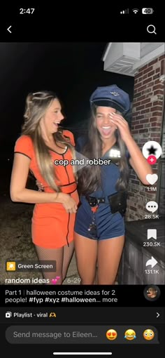 two beautiful young women standing next to each other in front of a brick wall at night