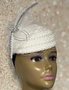 Simple, yet elegant. White lace Fascinator half hat trimmed with pearls, rhinestones, and veil netting. The hat is affixed to the head via a hatstring. The hat's circumference measures approximately 22.5 inches. PLEASE NOTE All items for Free Shipping will be shipped via USPS First Class Mail. Gifts for mom, sister, wife, or yourself. Elegant Tulle Bridal Accessories, Elegant Tulle Mini Hats For Evening, Elegant Adjustable Veil For Party, Elegant Mini Hats For Evening, Elegant Evening Bridal Accessories With Tulle, Elegant Evening Tulle Bridal Accessories, Elegant Tulle Bridal Accessories For Evening, Elegant Evening Bridal Accessories In Tulle, Elegant Fitted Evening Veil