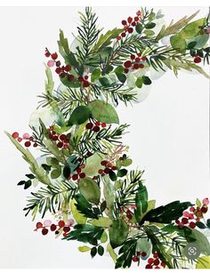 a watercolor wreath with red berries and green leaves