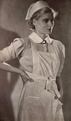 an old photo of a woman wearing a chef's hat and apron with her hands on her hips