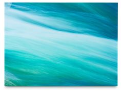 an abstract painting of blue and green water