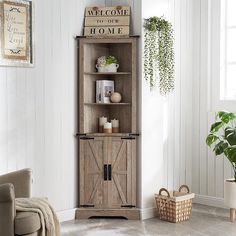 a living room with a wooden cabinet and potted plant