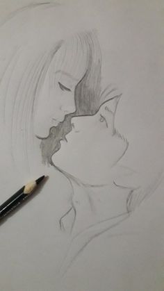 a pencil drawing of two people kissing each other