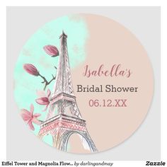 the eiffel tower with pink flowers on it's side is shown in this round