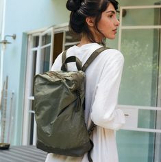 This charming backpack is made of topnotch nappa leather with premium reused polyester fabric in olive color. The fabric has a paper touch that make it perfect and unique. and the has a unique, soft, minimalistic shape. The perfect work/university bag - for carrying your laptop, lunch and other everyday must-haves. This contemporary backpack in simplicity at it's best. It has a zipper closure at the top, outside zipper pockets for mobile, keys, etc. It is fully lined with Black strong cotton fab Green Leather Backpack For On-the-go, Modern Green Leather Backpack For Travel, Khaki Backpack With Waxed Finish, Khaki Waxed Finish Backpack, Functional Green Leather Backpack For Everyday Use, Travel Backpack In Khaki Nylon, Khaki Leather Backpack For Daily Use, Khaki Nylon Travel Backpack, Green Functional Leather Backpack For Travel