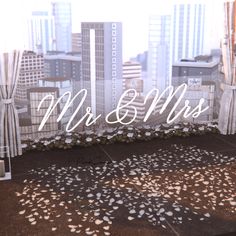 the words mr and mrs are in front of a cityscape