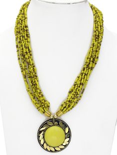 This is a fabulous necklace in Tourmaline look Yellow and Gold pendant, beads and glass intricately strung together in 12 beads strings.  The necklace is 20 inches long and hooks together at the back. #tlb #FashionNecklace #YellowNecklace #TribalNecklace #StringsNecklace Green Faceted Beads Necklaces For Festivals, Green Faceted Beads Necklace For Festivals, Green Beaded Necklace With Large Beads For Festivals, Adjustable Beaded Necklaces With Dangling Beads For Festivals, Adjustable Beaded Necklace With Dangling Beads For Festivals, Bridesmaids Outfits, Artificial Jewelry, Yellow Necklace, Yellow Jewelry