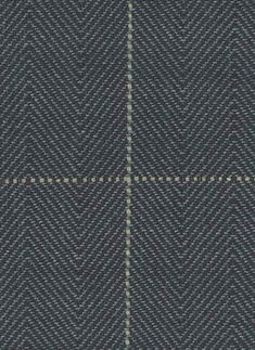 a blue and grey checkered fabric textured with white stitching on the side