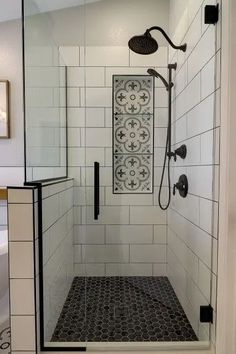 a walk in shower sitting next to a white sink and tiled floored bathroom wall