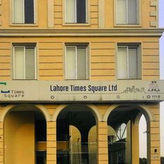 an old building with arches in front of it and the words labore times square ltd