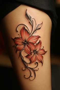 Two stylized red flowers with black swirling vines tattooed on skin. Colored Floral Tattoo Design, Fire Lily Tattoo, Elegant Flower Tattoo, Flower Tattoos Color, Single Flower Tattoo, Lily Tattoos, Dahlia Tattoo