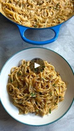 two bowls filled with pasta next to each other