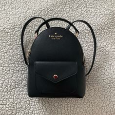 Kate Spade Mini Black Backpack Perfect For Special Occasions, Going Out, Vacation Travel, And More! Reason For Selling: I Received It As A Gift And Would Like To Declutter My Closet Flaws: There Is One Mild Scratch On The Front Pocket(See Pic 7) Condition: Brand New With Tags Dimensions: - Length: 7.75 Inches - Width: 3.25 Inches - Height: 9 Inches Please Let Me Know If You Have Any Questions Kate Spade Backpack With Removable Pouch, Kate Spade Black Backpack With Removable Pouch, Kate Spade Black Backpack With Detachable Strap, Kate Spade Chic Backpack With Detachable Strap, Kate Spade Black Backpack For On-the-go, Kate Spade Chic Backpack With Adjustable Strap, Kate Spade Backpack With Detachable Strap For Errands, Kate Spade Backpack With Adjustable Strap For Everyday Use, Kate Spade Backpack With Adjustable Strap For Errands