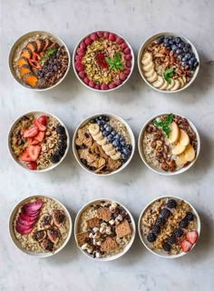 six bowls filled with different types of food on top of a white countertop next to each other