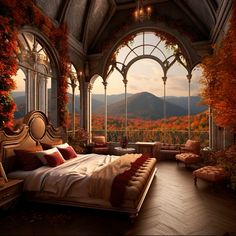 a bedroom with a large bed and an arched window overlooking the mountain range in autumn