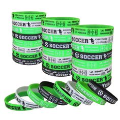 soccer wristbands are stacked on top of each other